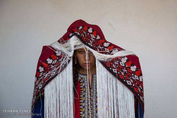 On the wedding day the bride wear something like a hat called ‘Karteh’ under her scarf as a sign to show she is married from now on. 