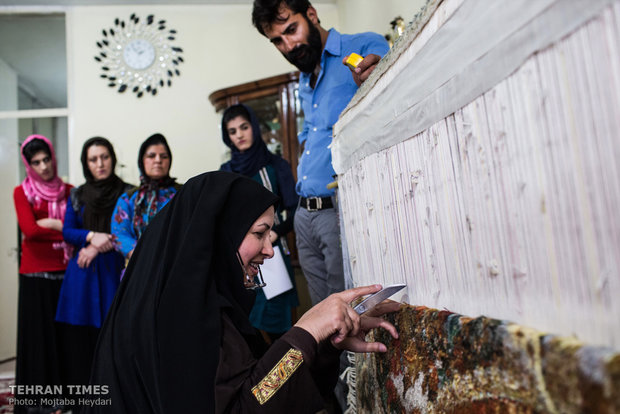 Nahid Hosseini is checking up on a carpet ordered by Russia. 