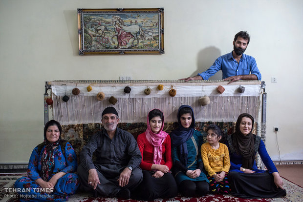 Family members of one of Hosseini’s trainees posing in front of the camera.