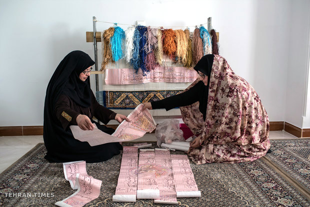 Hosseini is following up on the improvements of a carpet her trainee is weaving ordered by England.