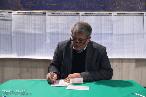 Top Iranian officials cast votes in early hours of election day