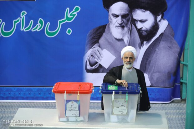 Top Iranian officials cast votes in early hours of election day