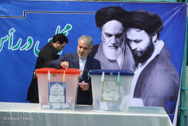 Top Iranian officials cast votes in early hours of election day