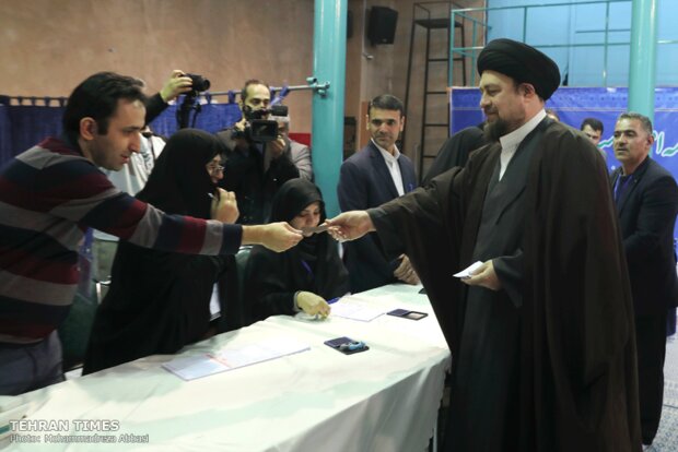 Top Iranian officials cast votes in early hours of election day