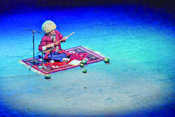 A Turkmen musician performs during a festival dedicated to the rituals and music related to Ashura, the martyrdom anniversary of Imam Hussein (AS).