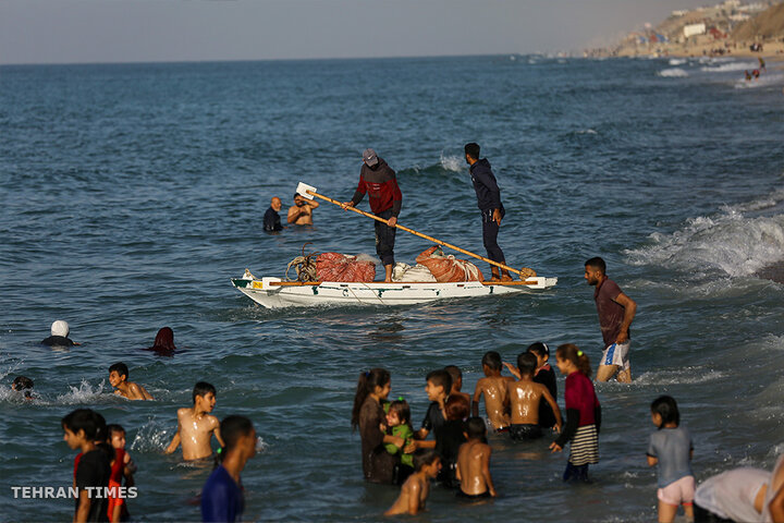 ‘Our only outlet’: Palestinians in Gaza go to the beach during Israel truce