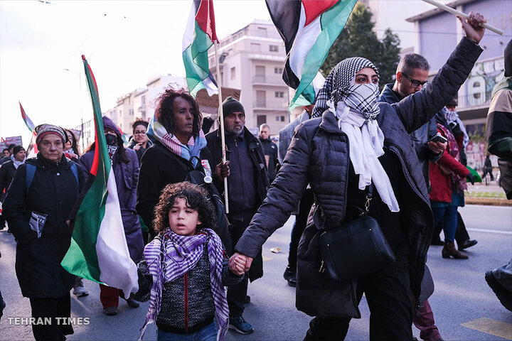 Protesters take part in a rally in support of Palestinians, in Athens, Greece. [Aggelos Barai/AP Photo]
