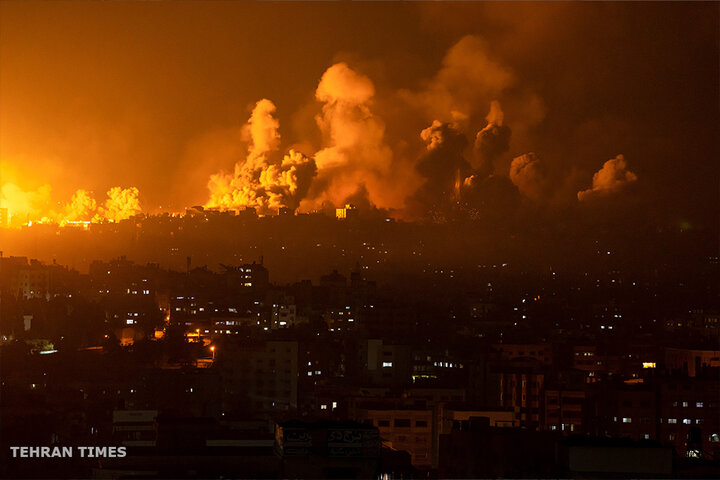 Fire and smoke rise following an Israeli airstrike on Gaza City. [Fatima Shbair/AP Photo]

