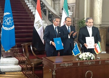 Director General of the International Atomic Energy Agency (IAEA) Rafael Grossi (left) after signing a nuclear safeguarding agreement with Iranian Foreign Minister Abbas Araghchi (right) in Cairo on September 9, 2025.