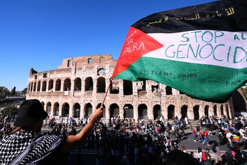Pro-Palestinian demonstrators pass in front of Rome’s Colosseum, Saturday, Oct. 4, 2025, during a march calling for an end to the war in Gaza.