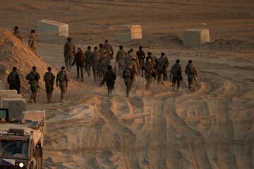 Israeli soldiers walk near the Israel-Gaza border, October 10, 2025.