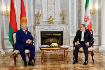 Iranian Foreign Minister Abbas Araghchi (R) meets with Belarusian President Alexander Lukashenko in Minsk on December 15, 2025.