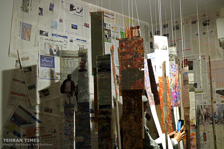 Painting on the news: Iranian artist turns newspapers into art