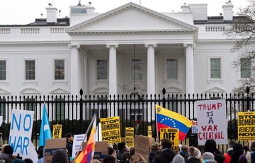 Protesters rally outside the White House Saturday after the U.S. captured Venezuelan President Nicolás Maduro and his wife in a military operation.