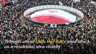 Tehranis attend Quds Day Rally amid attack on a residential area close by