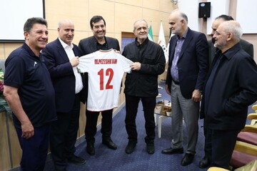 Pezeshkian presented with Iran No. 12 shirt