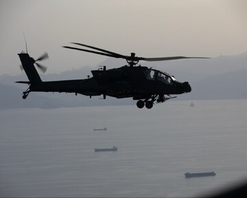 An AH-64 Apache flying above the strait of Hormuz