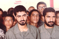 Commander Qassem Soleimani (L) among a group of volunteers on the frontline during the 1980-1988 Iran-Iraq war.
