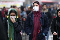 Iranian women wear protective masks to prevent contracting a coronavirus, as they walk at Grand Bazaar in Tehran, Iran February 20, 2020. (Photo credit: Reuters)