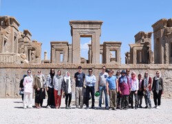 File photo depicts international travelers posing for a photo during their visits to the UNESCO-registered Persepolis, which was once the ceremonial capital of the mighty Achaemenid Empire (550-330 BC), in southern Iran.