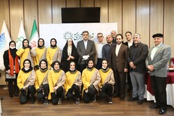 Crew members of “No Place for Angels” about the national Iranian women’s hockey team, Tehran Mayor Piruz Hanachi and some DEFC officials pose after a screening of the documentary at Milad Tower on May