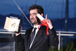 Iranian actor Shahab Hosseini poses with the best actor award for the movie “The Salesman” at the Palme D’Or Winner Photocall during the 69th annual Cannes Film Festival