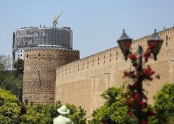 File photo depicts the centuries-old Arg-e Karim Khan with a modern hotel being constructed in the background, distorting general views of the brick fortress in Shiraz, southern Iran.