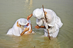 Mandaeans practicing baptism in Karun River