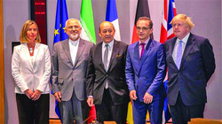 Iran's Foreign Minister Mohammad Javad Zarif (C) with Britain's former UK Foreign Secretary Boris Johnson (R), France's Foreign Minister Jean-Yves Le Drian (L), Germany Foreign Minister Heiko Maas (2nd L) at the EU headquarters in Brussels on May 15, 2018. (Photo: YVES HERMAN/AFP VIA GETTY IMAGES)