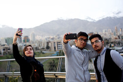 Iranian youths take a selfie on the Tabi'at (Nature) bridge overlooking Tehran