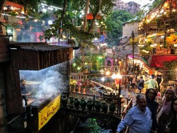 A succession of teahouses, restaurants and fruit-conserve stalls are seen in the rocky village of Darband, northern Tehran.
