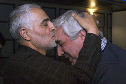 Lieutenant-General Qassem Soleimani kisses filmmaker Ebrahim Hatamikia in an undated photo.