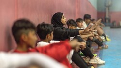 Afghan coach helps young refugees back to school in Iran