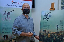 Co-director Morteza Payeshenas signs a poster for “The Barrage” before a special screening of the documentary at the Iranian Artists Forum in Tehran on September 29, 2020. (DEFC) 