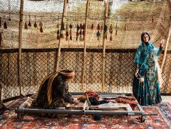Nomads are seen at a carpet production workshop outside Shiraz, southern Iran (Credit: The New York Times)