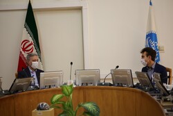 Mahmoud Nili Ahmadabadi, the chancellor of the University of Tehran (L), and Giuseppe Perrone, the Italian Ambassador to Iran
