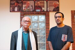 Translators Ali-Asghar Haddad (L) and Mohammadreza Torktataari pose after accepting the Abolhassan Najafi Award at the Book City Institute in Tehran on January 26, 2021. (BCI)