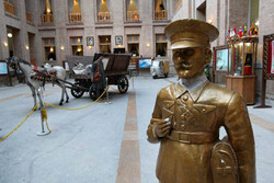 An interior view of the Post and Communications Museum in downtown Tehran. An statue of an Iranian postman is also seen in the foreground.