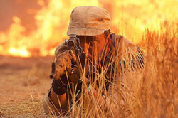 Kambiz Dirbaz acts in a scene from “The Sniper”.