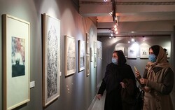 Art enthusiasts visit an exhibition of prints by Iranian and foreign artists during the 13th Fajr Festival of Visual Arts at the Saba Art and Cultural Institute in Tehran on February 6, 2021. (Tasnim/