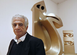 Iranian sculptor Parviz Tanavoli poses with a work from his Heech series in a file photo. 