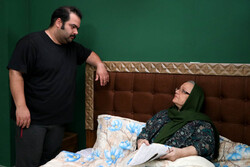 Soheil Qannadan (L) and Nahid Haddadi act in a scene from “The Son” directed by Nushin Meraji.