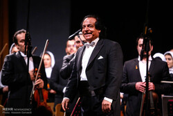 Maestro Ali Rahbari conducts the Tehran Symphony Orchestra in an undated photo. (Mehr/Hossein Esmaeili)