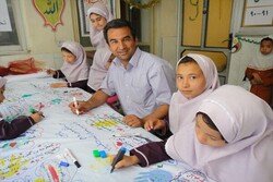 A file photo shows Afghan book reading promoter Nader Musavi attending a class at an Iranian school for Afghan children.    