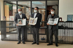 Tehran Museum of Contemporary Art director Ehsan Aqai (L), Deputy Culture Minister for Artistic Affairs Seyyed Mojtaba Hosseini (C), and Visual Arts Office director Hadi Mozaffari hold copies of books