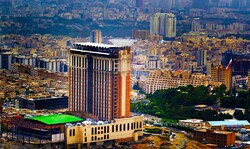 A view of Tehran with the five-star Espinas Palace Hotel in the foreground.