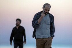 Javad Ezzati and Hadi Hejazifar act in a scene from “Atabai” directed by Niki Karimi.