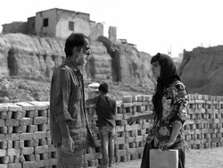 Ali Baqeri and Mahdieh Nassaj act in a scene from “The Wasteland”.