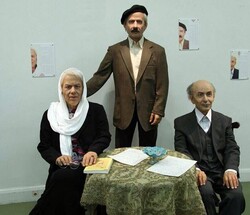 CAP: Photo depicts wax figures of the contemporary Iranian literary figures Nima Yushij (R), Jalal Al-e-Ahmad (c) and Simin Daneshvar.