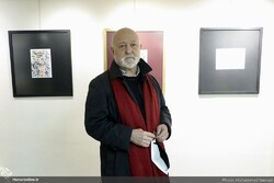 Calligrapher Mohammad Ehsai poses after the opening ceremony of an exhibition of his works at Golestan Gallery in Tehran on November 5, 2021. (Honaronline/Mohammad Namazi)